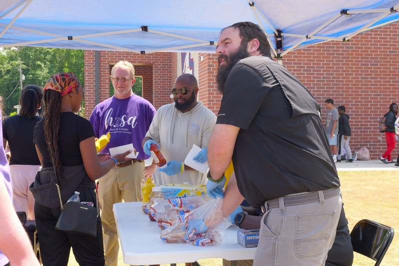 Students line up for hotdogs at Wagener-Salley Walk-a-thon event.