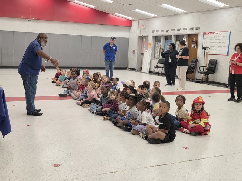 Students listening to drone operator.