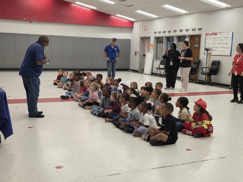 Students listening to drone operator.