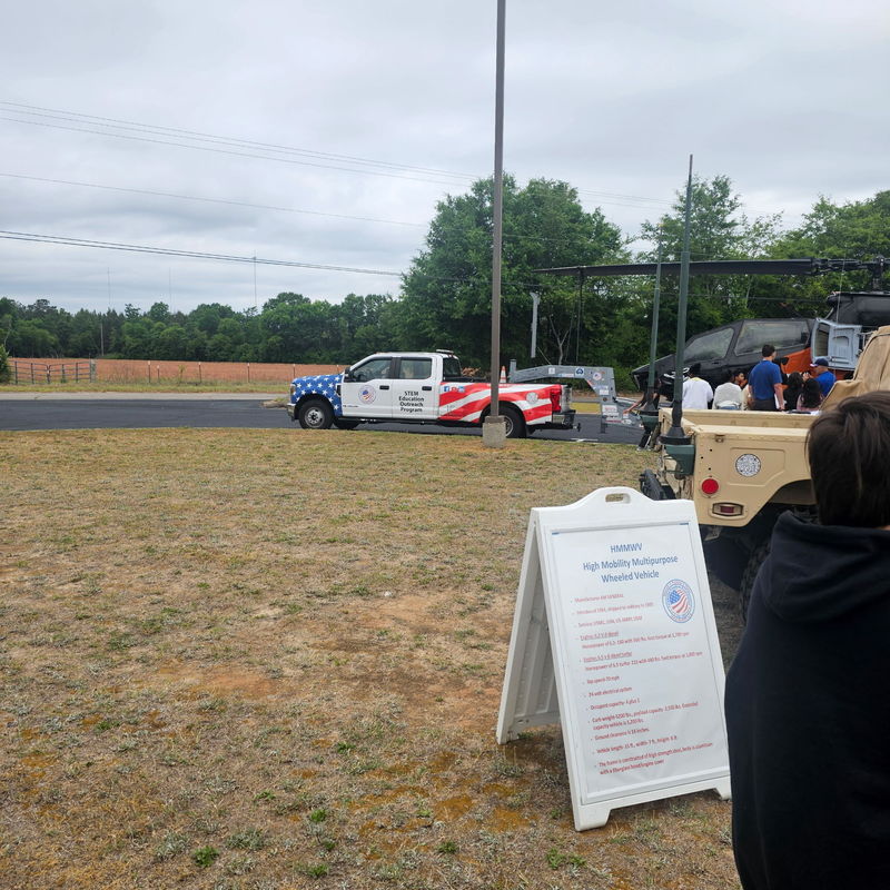 Truck pulling helicopter.