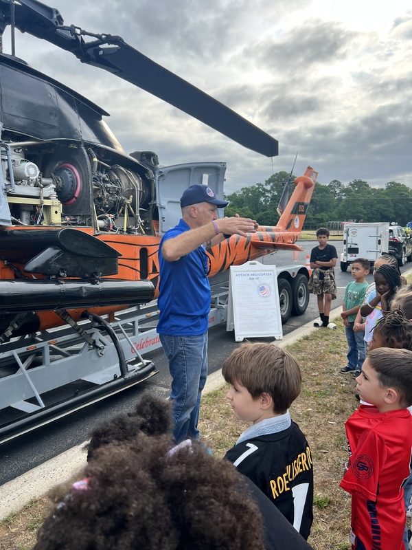 Students exploring helicopter.