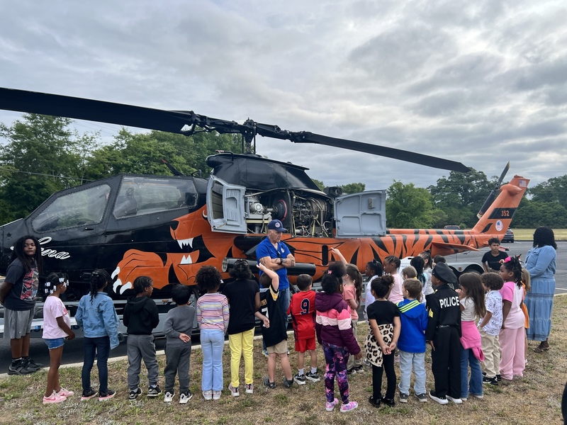 Students exploring helicopter.