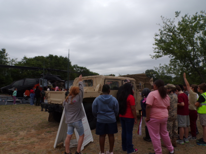 Students exploring humvee.