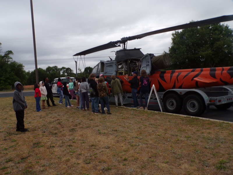 Students exploring helicopter.