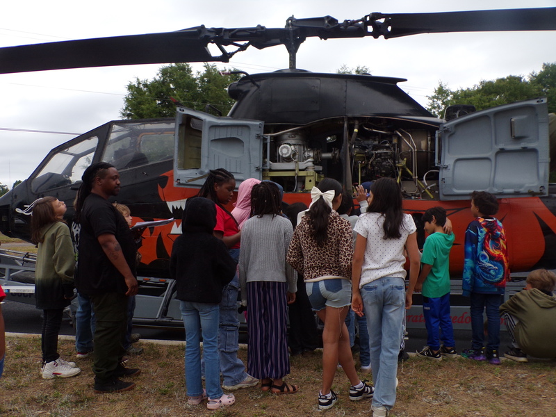 Students exploring helicopter.