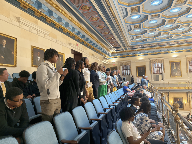 NAHS girls basketball team standing and being recognized by House.