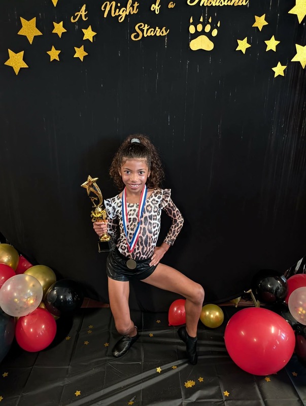 Student holding trophy.