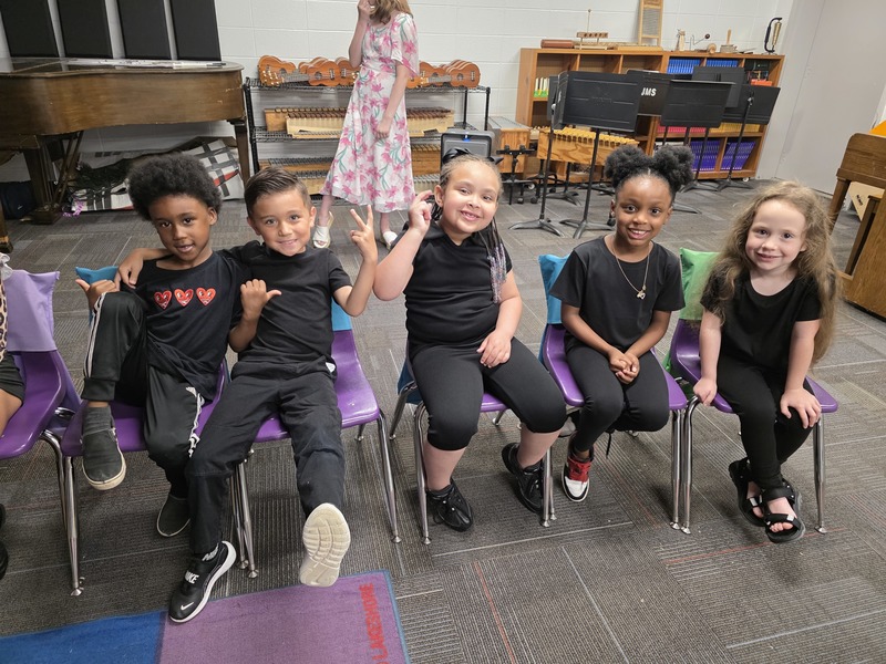 Students sitting in chairs.
