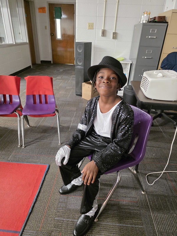 Student sitting in chair.