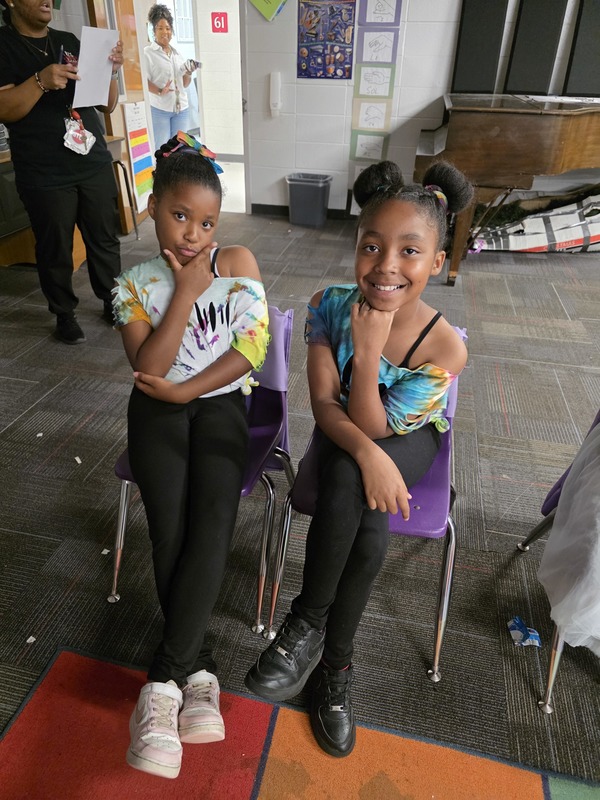 Students sitting in chairs.