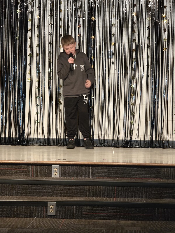 Students performing on stage.