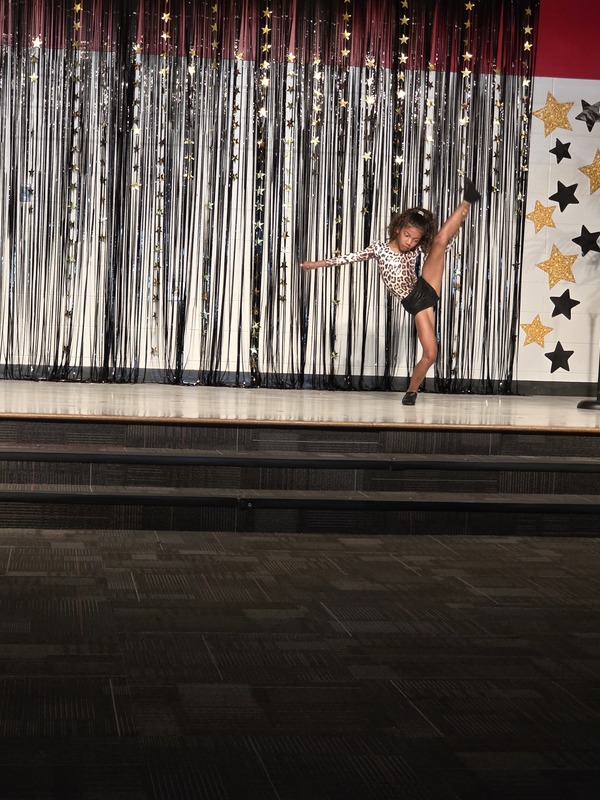 Students performing on stage.