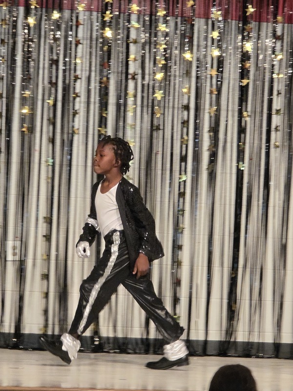 Students performing on stage.