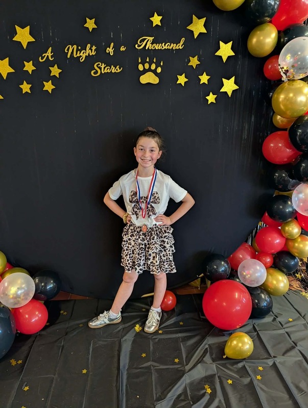 Performer with medal.