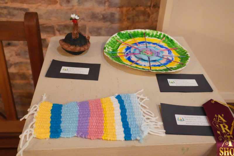 knitted scarf and colorful plate.