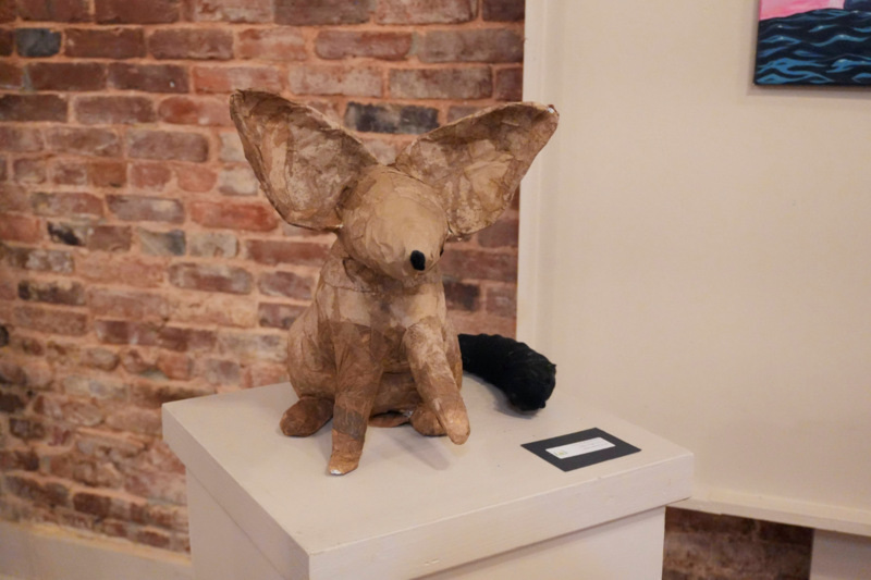 Paper 3D artwork forming a mouse.