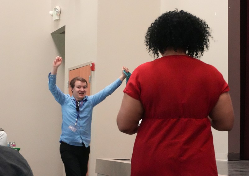 A student celebrates receiving a certificate.