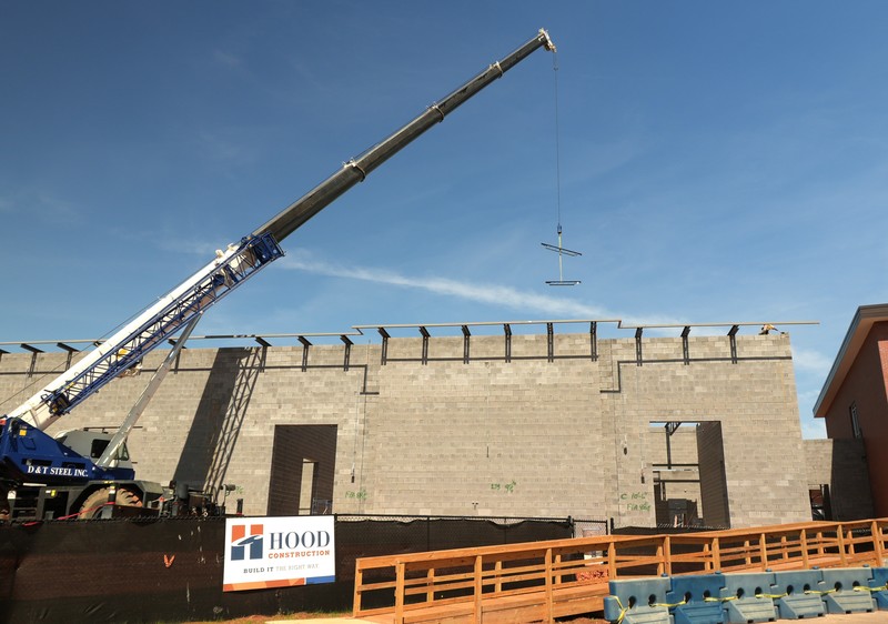 Construction vehicle preparing to place down beam.