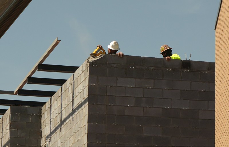 Construction workers working on the building.