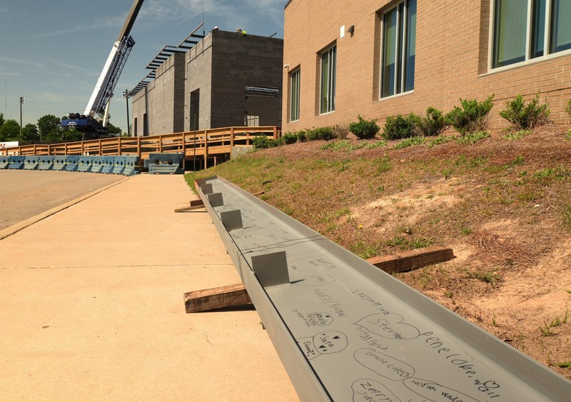 Shot of the beam with all the signatures, and the construction in the background.