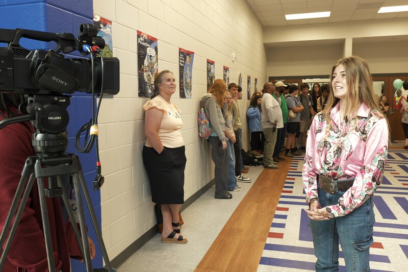 A student is being interviewed for her commitment to teach agriculture education.