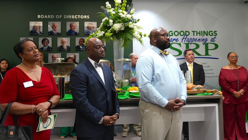 Dr. Corey Murphy stands with education and community leaders. 