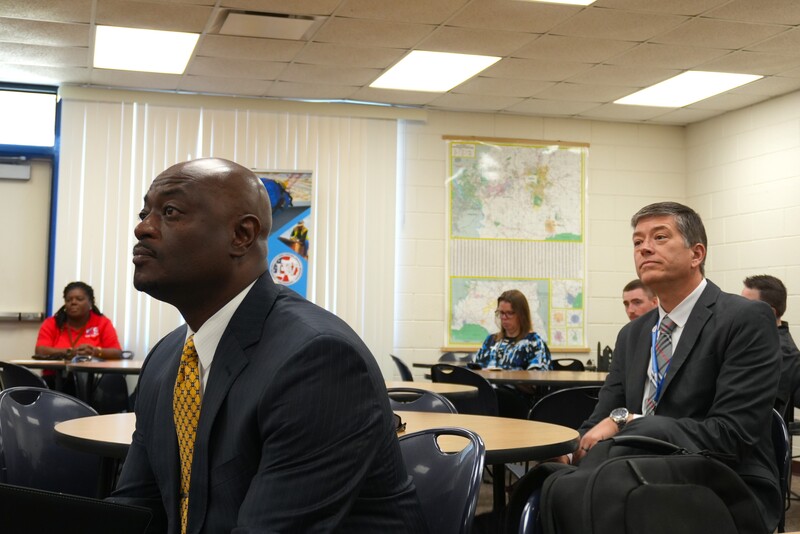 Dr. Corey Murphy and Mr. Bert Postell listen to remarks.