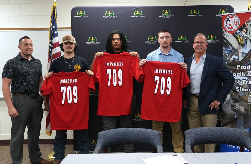 Students showcase new Ironworkers Trade T-Shirts as a sign of thier commitment.