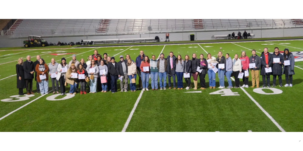ATHLETES AND EDUCATORS ON SOCCER FIELD