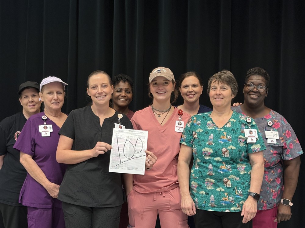 CNP staff holding their 100 health score