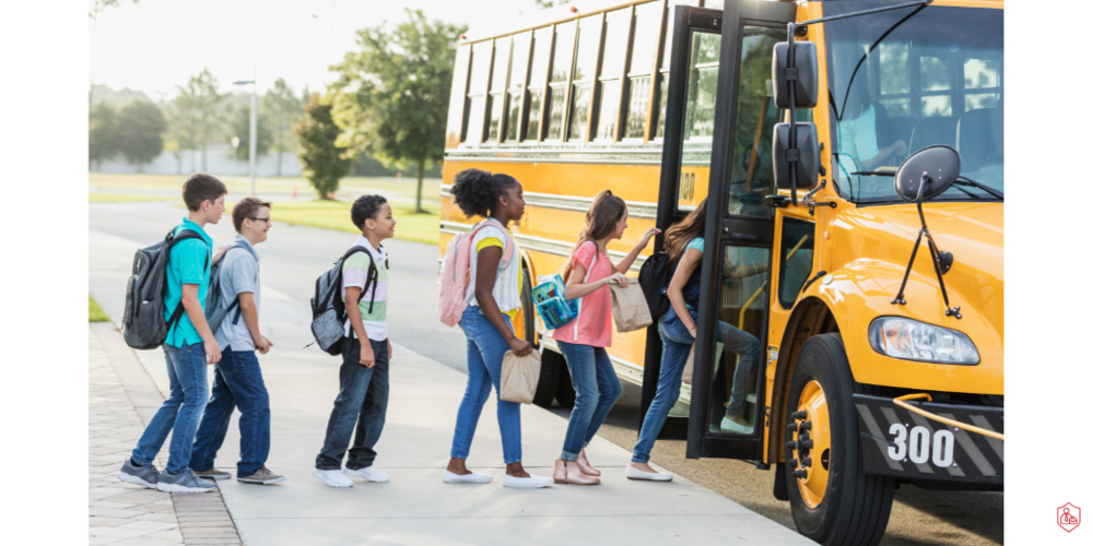 STUDENTS BOARDING BUS ON SUNNY DAY