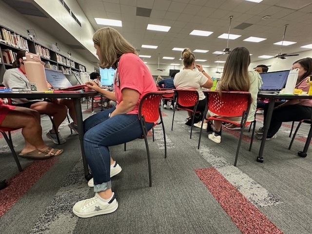 teachers sitting at tables