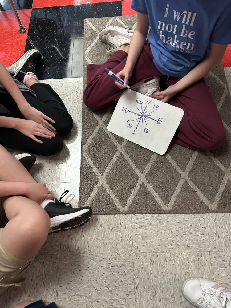 student with white board
