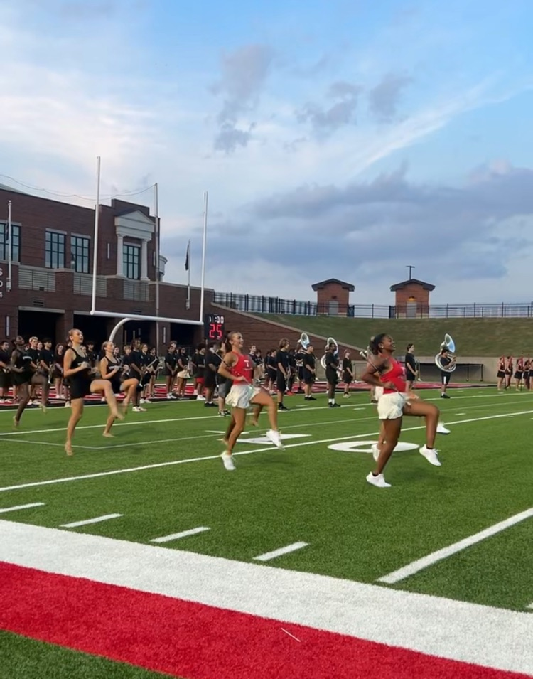 Cheerleaders marching out on field