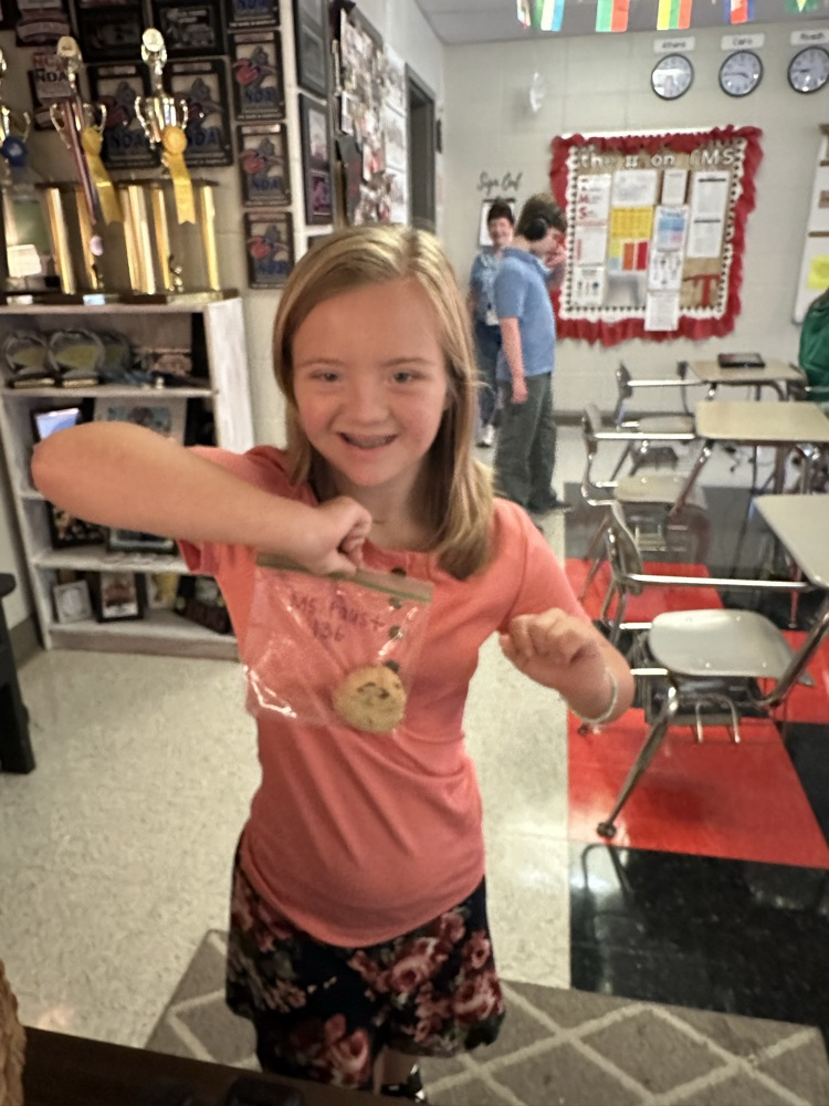 student delivering cookie
