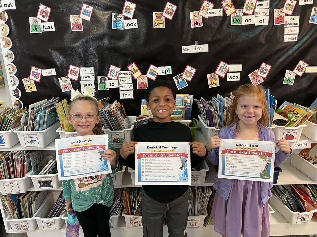 3 kids holding certificates