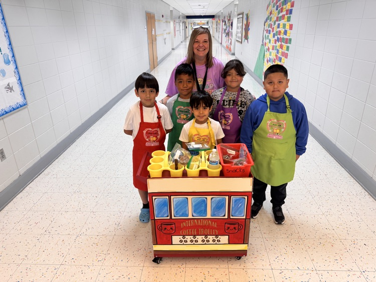 students and teacher in hallway with coffee cart 