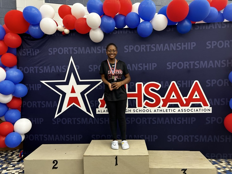 female swimmer, standing on stage