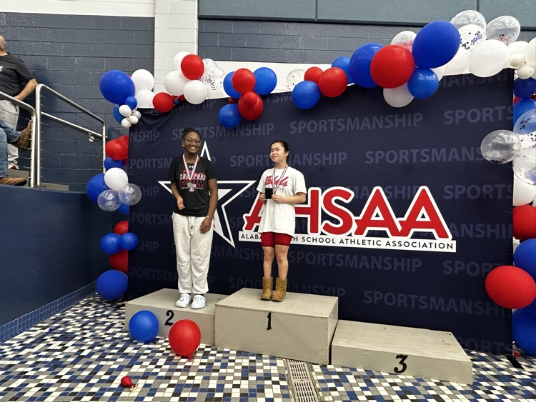 Group of swimmers being honored at a state swim meet