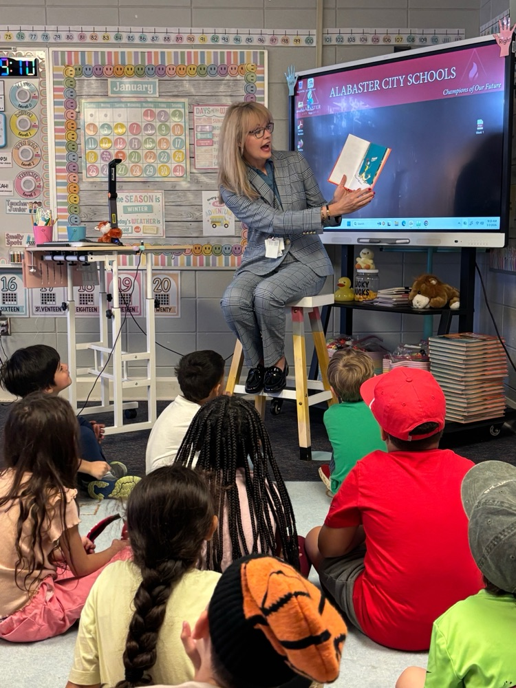 Woman with classroom full of children