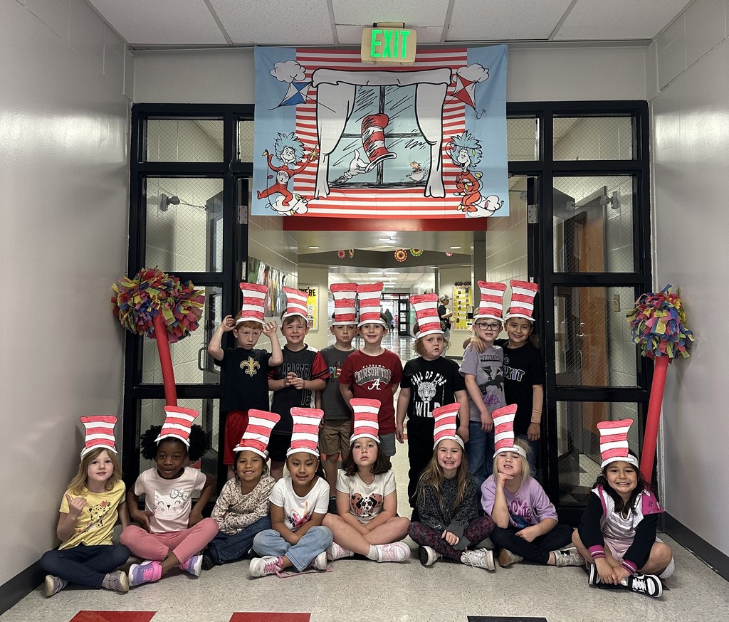 kids in hallway wearing cat in the hat hats