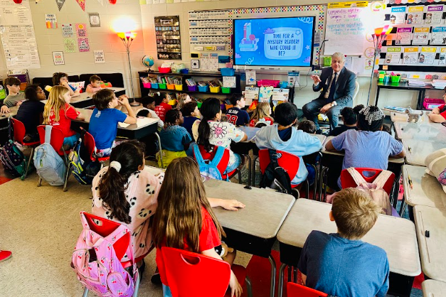 dr. vickers reading to a class