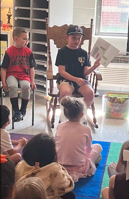 student reading to the class