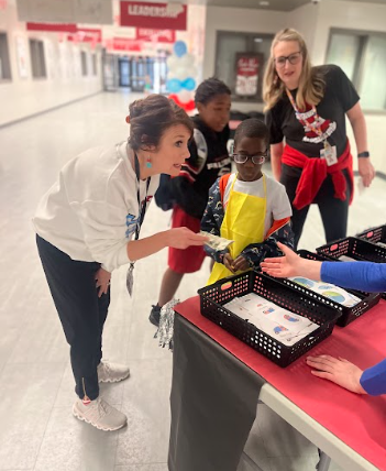 ms. thames buying a sticker