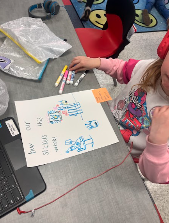 little girl showing off her sign