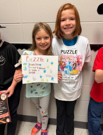 2 girls dressed as the word puzzle