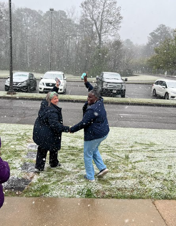 2 teachers playing in snow