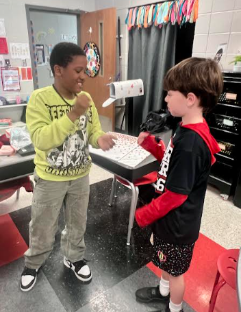 kids playing rock paper sissors