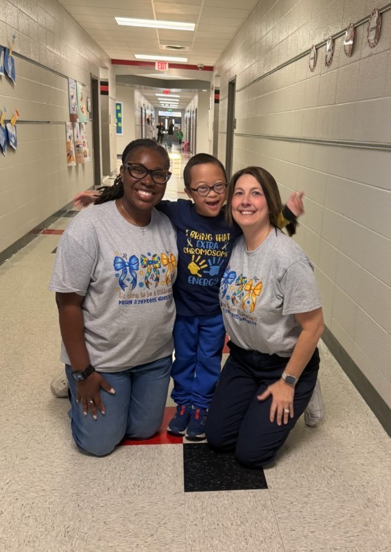 2 teachers with a student