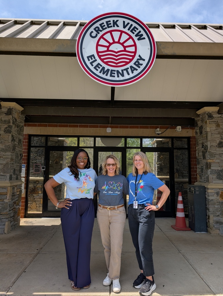 conwell, Cole & Maddox in front of sch